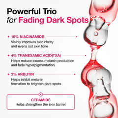 Pink tinted watery gel texture of Anua Dark Spot Correcting Serum dropped onto clean skin