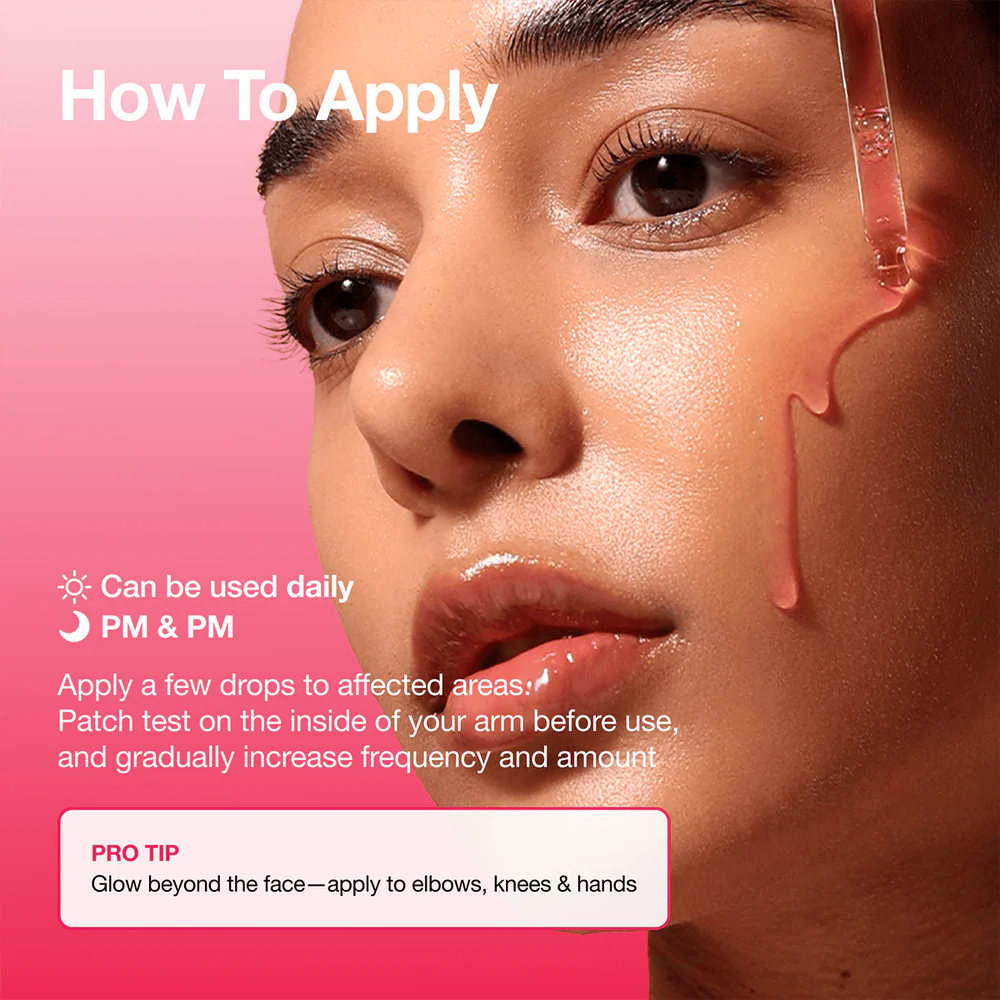 Pink tinted watery gel texture of Anua Dark Spot Correcting Serum dropped onto clean skin